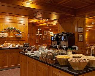Wooden interior with bread and breakfast buffet in the restaurant.