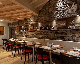 A stylish restaurant with wood and stone elements.