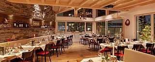 Cozy restaurant with set tables and stylish ambiance.