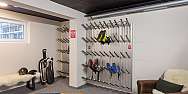 A ski room with shelves for shoes and equipment.