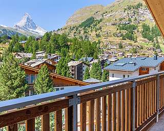 View from a balcony of the Matterhorn and surrounding mountains.