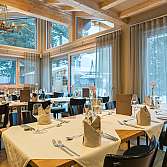 Cozy restaurant with set tables and stylish ambiance.