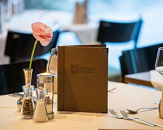 A buffet with various dishes in a rustic restaurant.